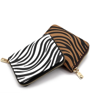 Zebra and tiger print leopard style card holders with golden zippers on white background