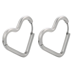 Detailed close-up of polished silver heart-shaped stainless steel huggie earrings