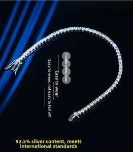 Macro detail of 925 sterling silver tennis bracelet with moissanite and double safety clasp