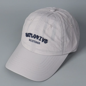 Detail of embroidered letters on light gray quick-dry baseball cap with tech fabric