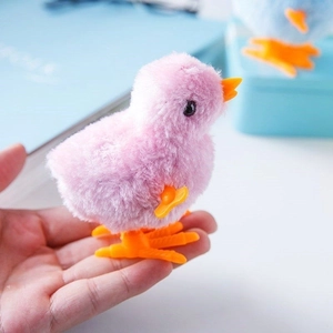 Pink plush wind-up jumping chicken toy for kids with soft fur and orange plastic feet