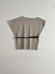 Close-up of light grey ribbed knit texture with a slim black leather belt and gold buckle