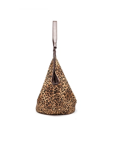 Close-up of leopard print tote bag featuring brown straps and unique triangular hobo shape