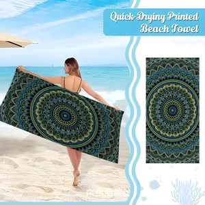 Detailed pattern of a quick-drying mandala beach towel with vibrant geometric prints