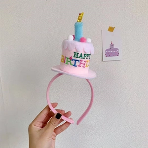 Pink plush birthday cake headband with colorful candles and Happy Birthday embroidery
