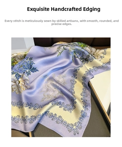Detailed view of hand-rolled edges on purple silk scarf with floral peony print
