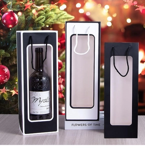 Detail of wine gift bags with clear window and rope handles in festive setting