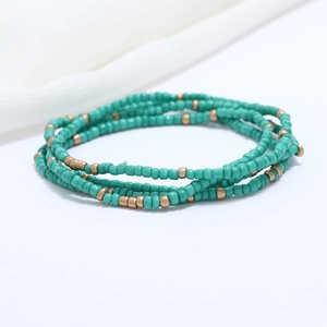 Detail of double-layer bohemian waist chain with turquoise and bronze seed beads