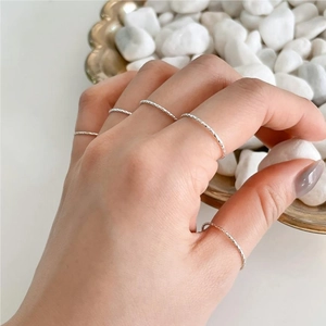 Minimalist S925 sterling silver thin stacking ring set with rope texture on model hand