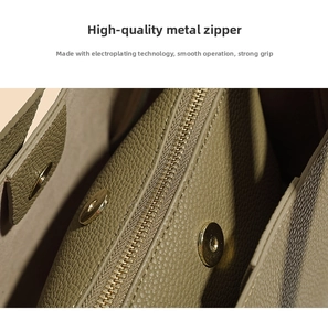 Close-up of premium electroplated gold zipper and magnetic closure on green leather bag