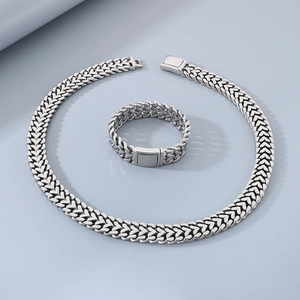 Polished stainless steel heart-shaped woven chain necklace and bracelet jewelry set
