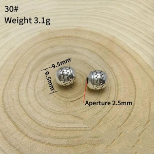 Detail of 9.5mm vintage silver spacer beads with engraved triangular patterns for DIY jewelry