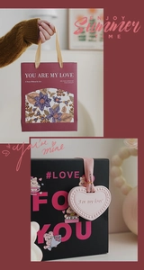 Detail of floral wine red gift bag and elegant heart-shaped tags for aromatherapy gifts