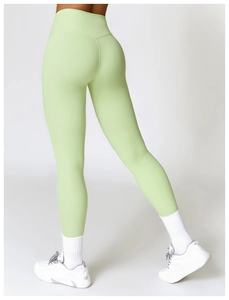Rear view of mint green high waisted yoga leggings showing slimming butt lift effect