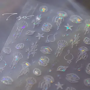Detailed laser holographic nail stickers featuring seashells, jellyfish and coral art