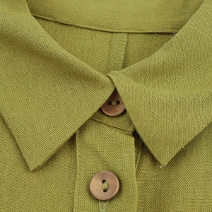 Olive green linen sleeveless dress with natural wooden buttons and rustic texture
