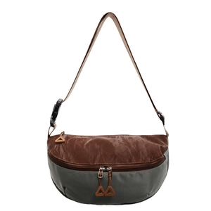 Detail view of the multi-compartment crossbody bag showing textured brown and grey fabrics