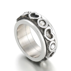 Silver stainless steel heart spinning ring with white cubic zirconia in a side view