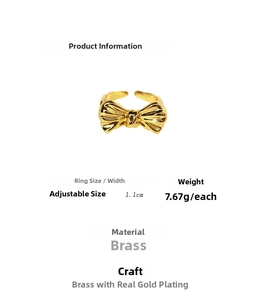 Detailed view of adjustable gold-plated brass bow ring with size and weight specs