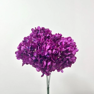 Detailed close-up of vibrant purple artificial hydrangea cluster with intricate petals