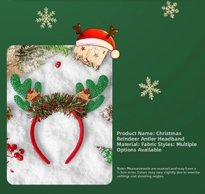Detailed view of Christmas reindeer antlers headband with red fabric and green glitter decor
