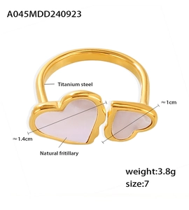 Detail of titanium steel heart ring showing natural shell inlay and precise dimensions