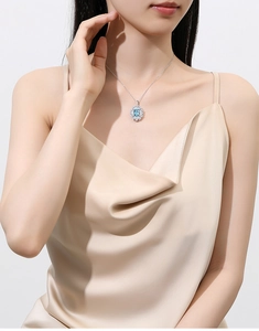 Detailed view of an S925 silver necklace featuring a rectangular light blue halo pendant