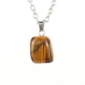 Detailed view of the polished tiger eye stone pendant with natural brown textures