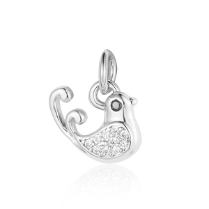 Macro shot of silver bird pendant featuring clear gemstones and black eye detail