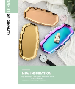 Detailed view of wave-edge stainless steel trays in gold, rose gold and rainbow finishes