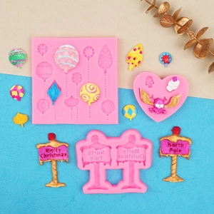 Pink silicone fondant molds for Christmas road signs, balloons and skull shapes