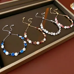Adjustable pull-out bracelet with colorful crystals and white beads in four elegant colors