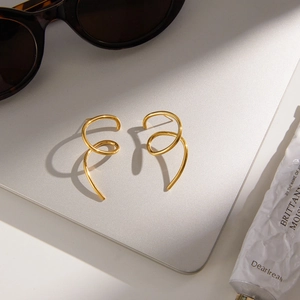 Modern gold irregular spiral stainless steel stud earrings with polished mirror finish