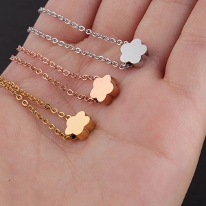 Minimalist flower pendant necklaces in silver, rose gold and gold stainless steel finish