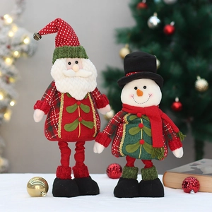 Standing Santa and Snowman plush figurines with knit outfits for Christmas window decor