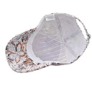 Interior detail of polyester baseball cap showing autumn leaf print and washing label