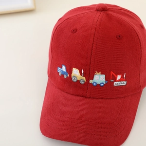 Red corduroy kids baseball cap with cartoon construction vehicle embroidery detail