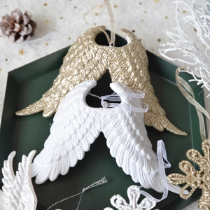Resin angel wings Christmas ornaments in white and gold colors for holiday tree decoration