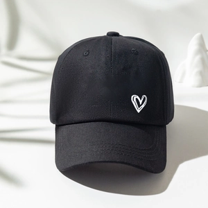 Black cotton baseball cap with white heart embroidery and curved brim for outdoor sun protection