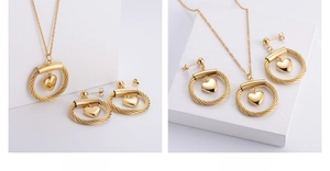 Detail of 18K gold plated heart necklace and earrings with spiral braided texture