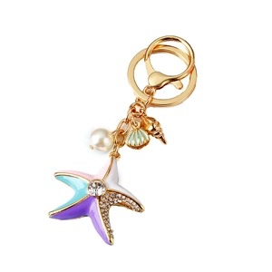 Starfish keychain with pearls and shells featuring colorful enamel and rhinestones