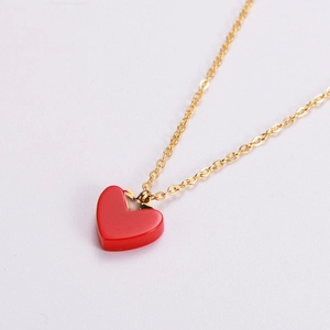 Minimalist red heart pendant necklace in rose gold finish with elegant cable chain