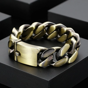Chunky bronze stainless steel Cuban link bracelet with large clasp on black background