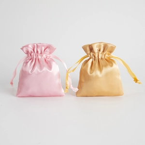 Satin Kordelzug Geschenktüten in Rosa und Gold, ideal für Schmuckaufbewahrung und kleine.