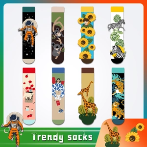 Detailed view of eight artistic printed socks featuring astronaut, koala and tiger patterns