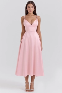 Macro detail of pink satin A-line dress showing V-neck design and delicate silk texture