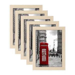 Detailed view of 5-piece natural wood picture frames set with vintage London street art