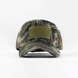 Close-up of vintage camo baseball cap with distressed details and US flag embroidery