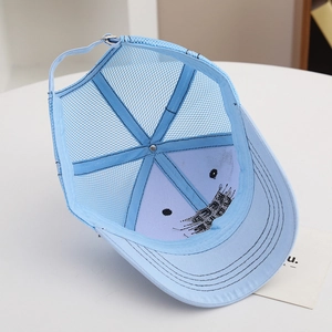 Detail view of the breathable mesh back and adjustable strap on the blue trucker hat