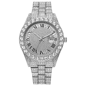 Macro detail of silver hip hop watch featuring full diamond setting and Roman numerals